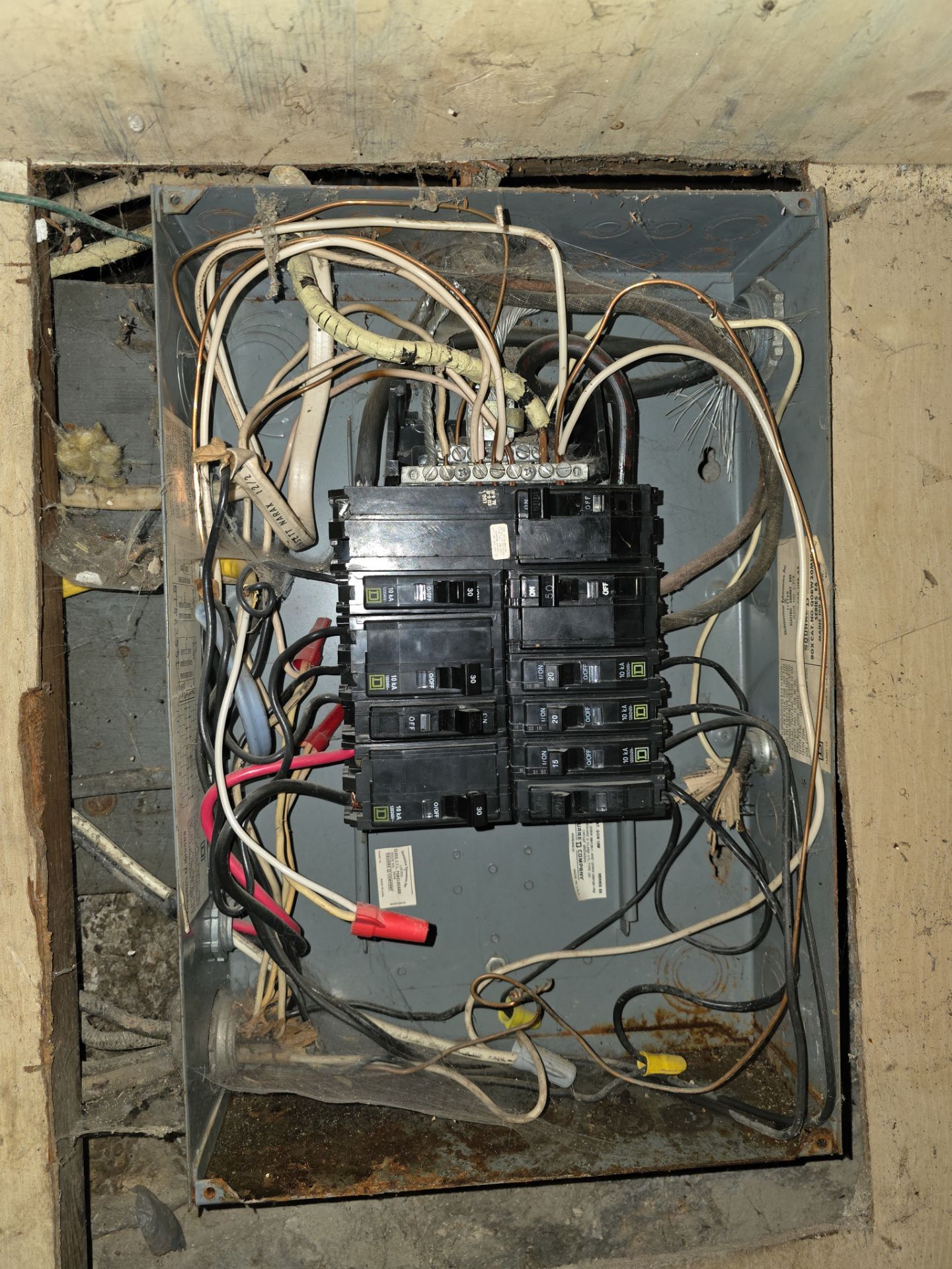 Breakers being sized and connected inside an electrical panel during a Keokuk, Iowa service upgrade by T.A.P. Electric